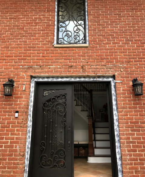 iron door in brick house
