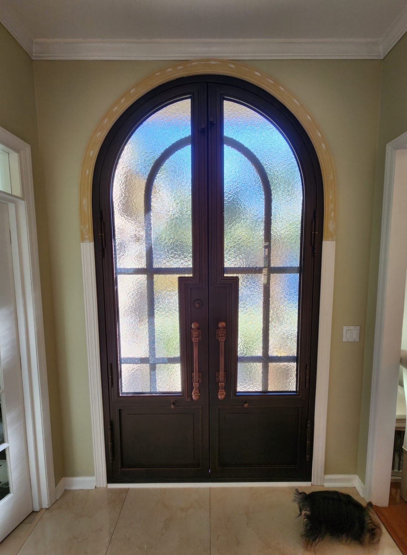 Wrought iron door with glass feature